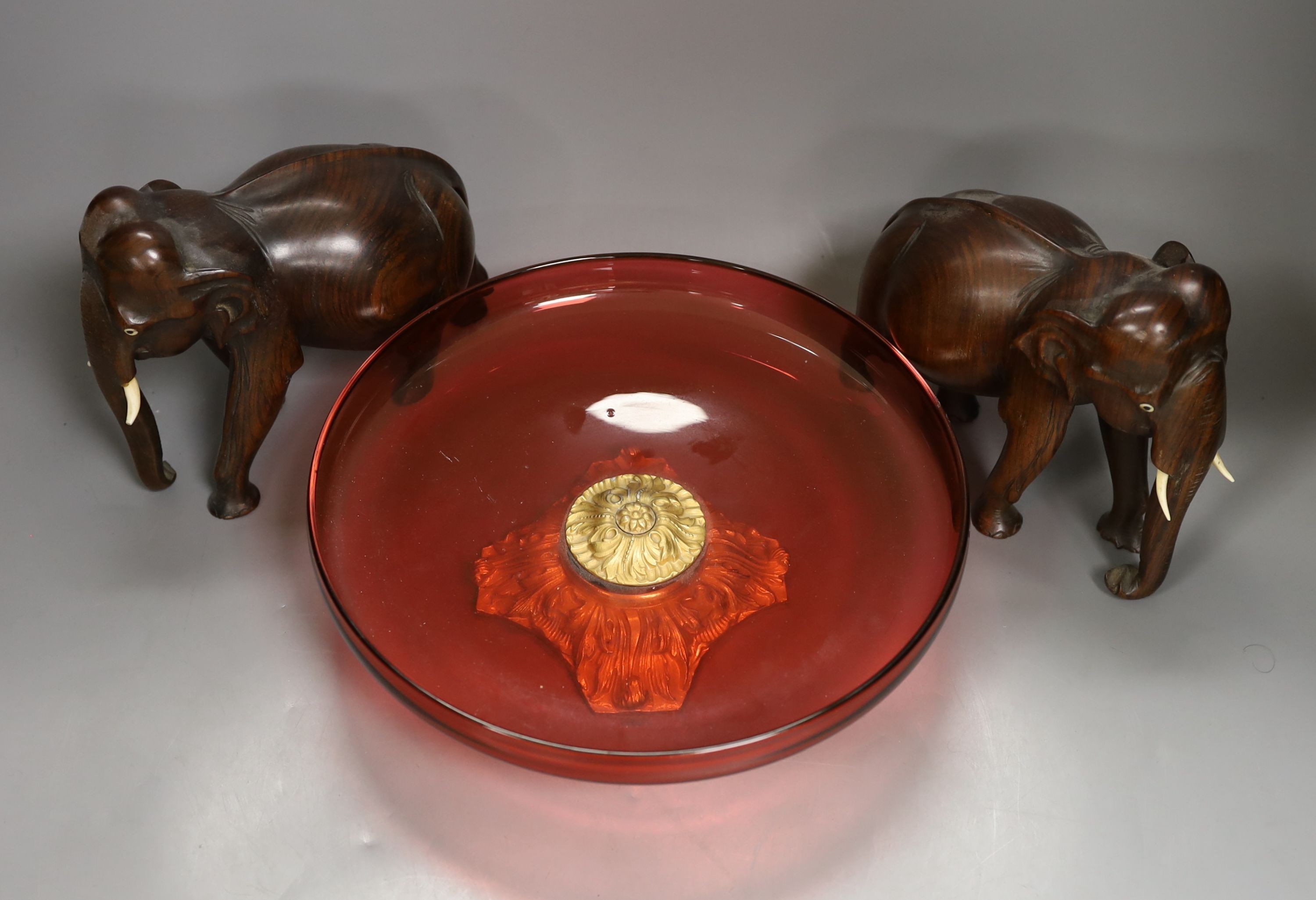 A cased Meerschaum pipe, a bronze group of a jockey on a horse, a ruby glass and gilt metal mounted dish, 26.5 cms diameter. etc